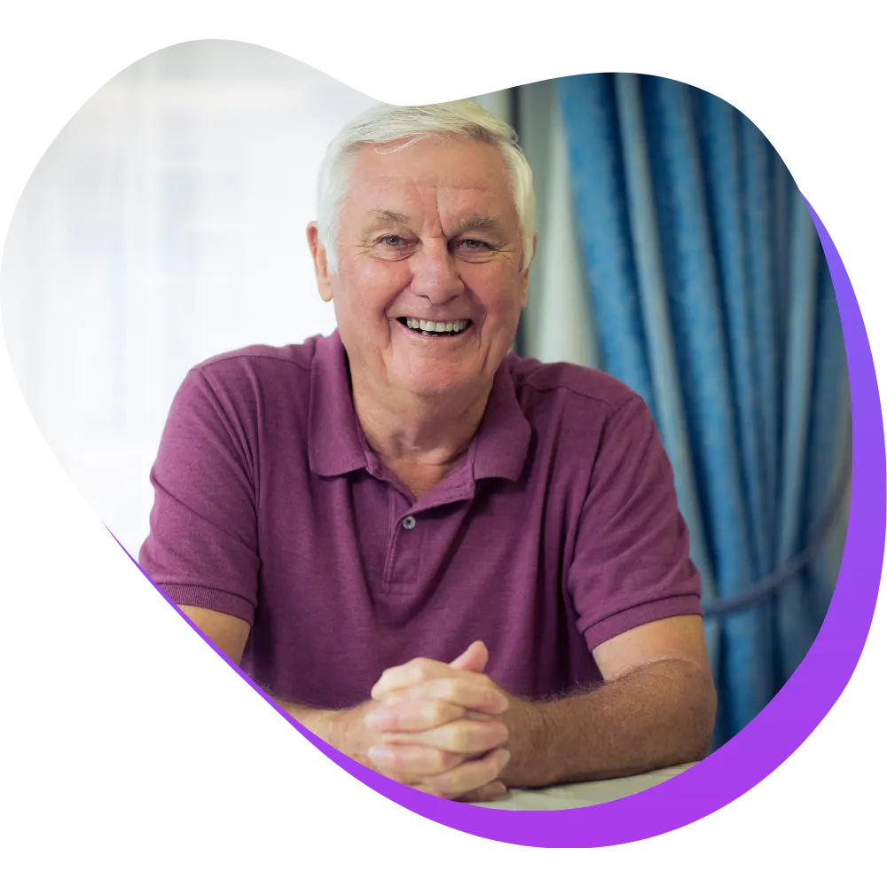 Elderly man smiling at camera