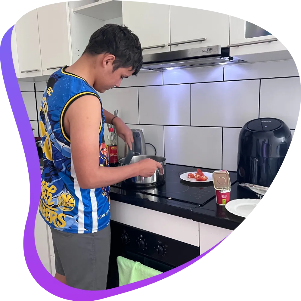 Teenage boy cooking