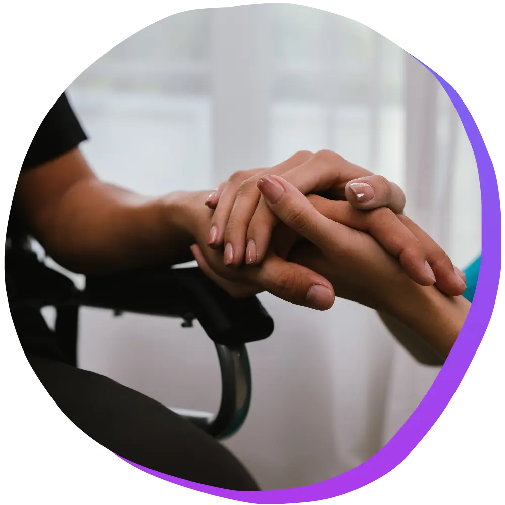Close up of nurse holding patients hands