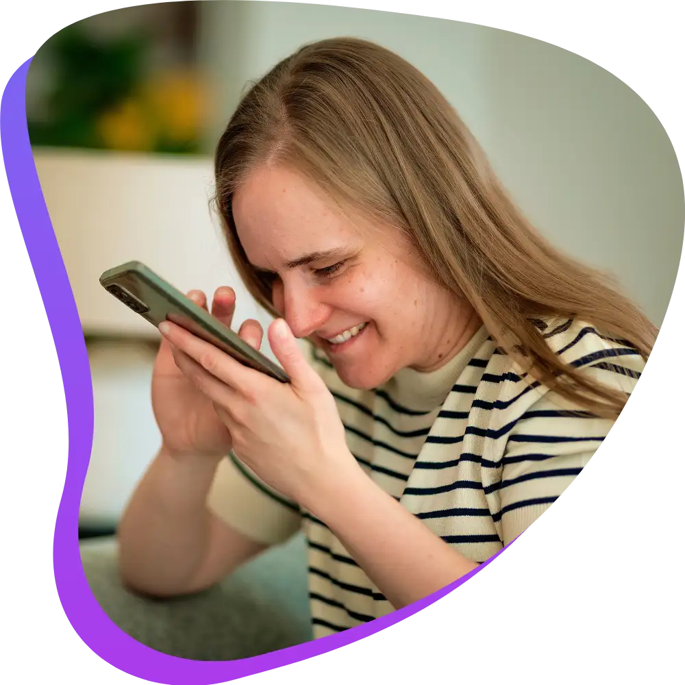 Deaf woman using phone to contact Azana Cares